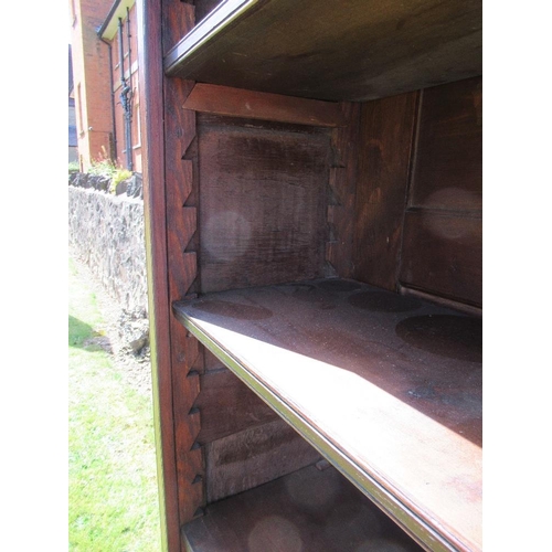 54 - (62) A low oak dresser with close boarded open shelves over fitted three drawers within a shaped fri... 