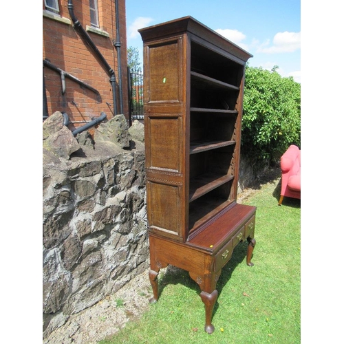 54 - (62) A low oak dresser with close boarded open shelves over fitted three drawers within a shaped fri... 