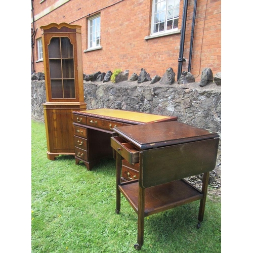 55 - (61) A reproduction mahogany desk, width 46.5ins, together with a yew wood free standing corner cupb... 