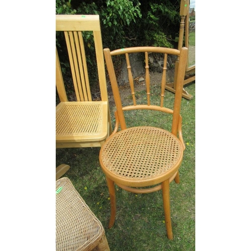 61 - A drop leaf kitchen table and two chairs together with a linen basket and a wicker shelf unit