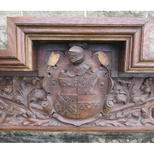 64B - An oak fire surround, with carved decoration