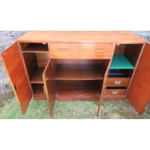 65 - A burr wood and mahogany breakfront sideboard, fitted with a drop front drawer over a double door cu... 