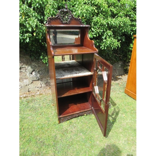 70 - An Edwardian mahogany music cabinet width 21.5ins