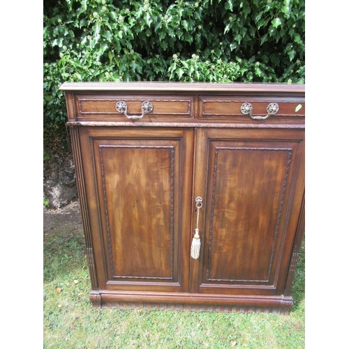 71 - A reproduction mahogany cupboard with two drawers and two cupboards, width 36ins