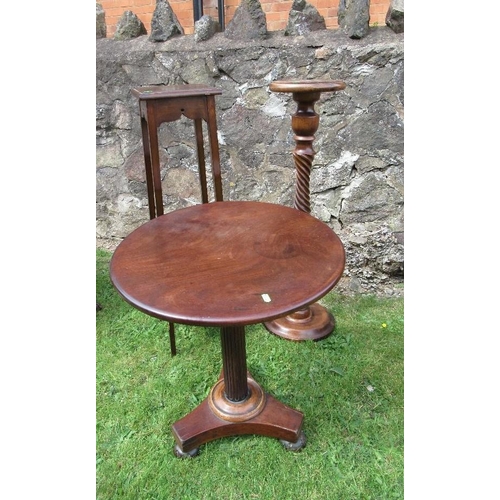 73 - A circular Victorian mahogany occasional table diameter 21ins together with two jardinière stands