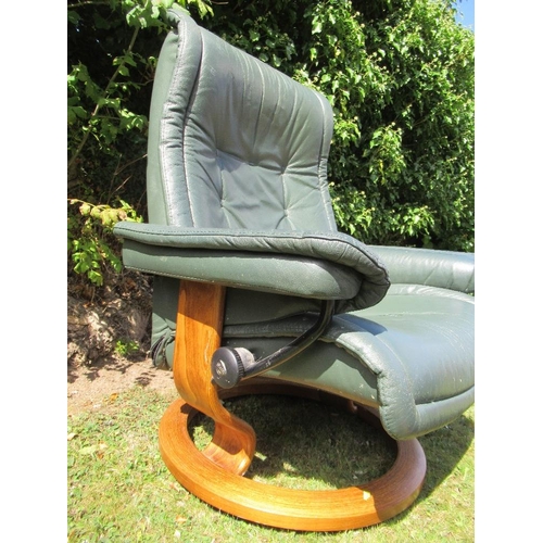 8 - (55) A modern leather effect chair and stool