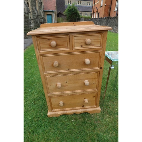 81 - A modern pine chest of drawers together with a glass occasional table