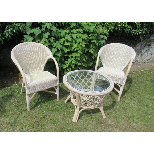 9 - A pair of wicker arm chairs and a circular glass top table diameter 24.5ins