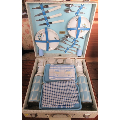 103 - A Brexton picnic set, the hard case fitted with thermos flasks, plastic boxes, plates, cutlery etc