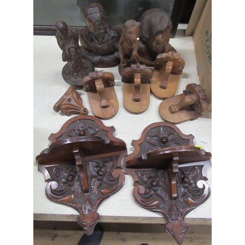 149 - A collection of carved wooden items to include wall shelves, models etc