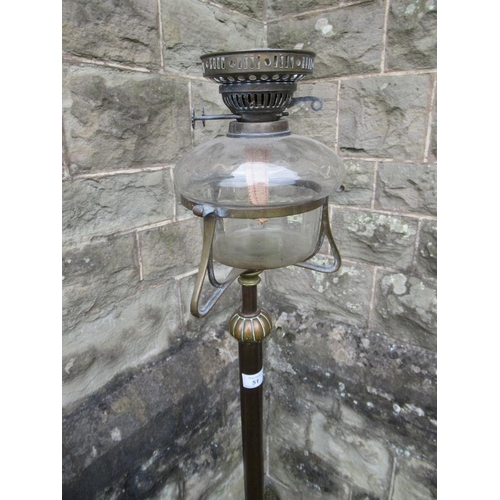 32 - A 19th century wrought iron oil lamp , with telescopic stand