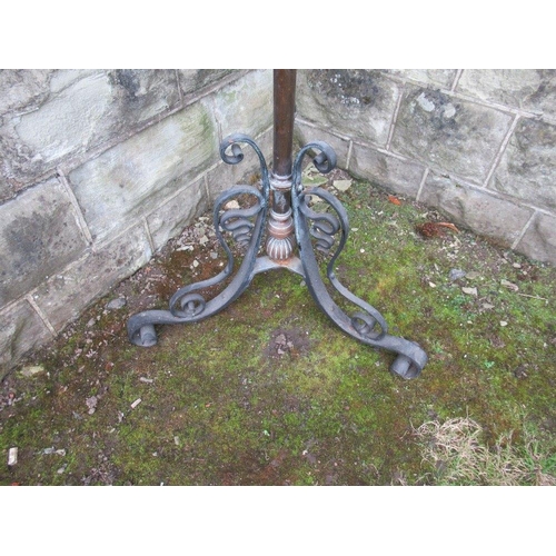 32 - A 19th century wrought iron oil lamp , with telescopic stand