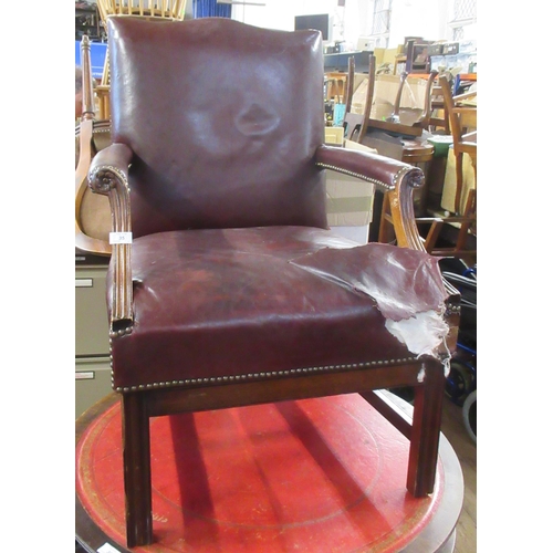 35 - A leather open arm chair,