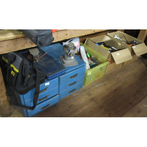 79 - A tool chest and various boxes of tools and two step ladders