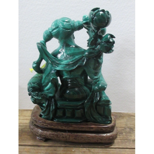 123 - An Oriental agate style model, of a seated figure, height 5ins