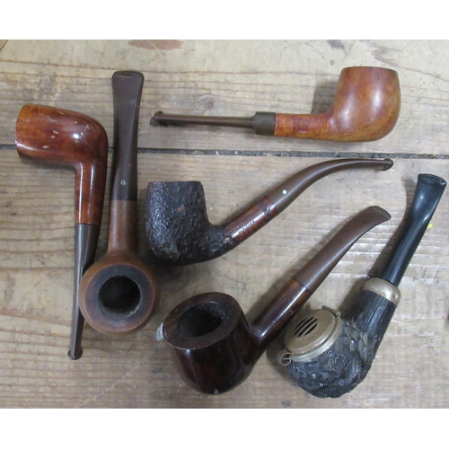 125 - A collection of pipes, together with a rack