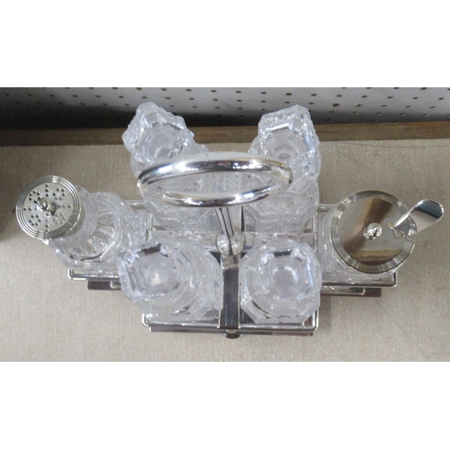 166 - A silver plated cruet stand, fitted with six glass condiment pots