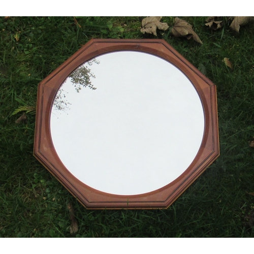 178 - Hugh Birkett, a yew wood framed octagonal convex mirror, overall diameter 13.5ins