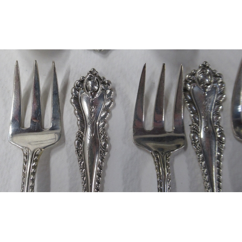 221 - A collection of flatware, to include 11 teaspoons, 10 coffee spoons, 12 small forks, etc, all marked... 