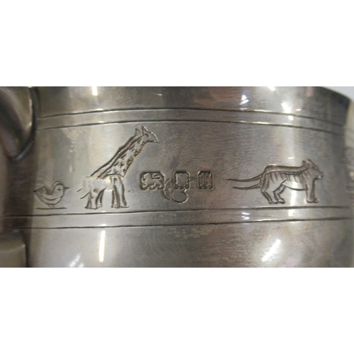 230 - A silver two handled bowl, engraved with Noah's ark, animals, figures and an inscription, weight 7oz