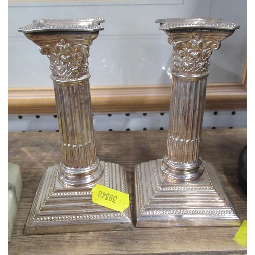 256 - A bronze effect model, of a huntsman and a pair of candlesticks