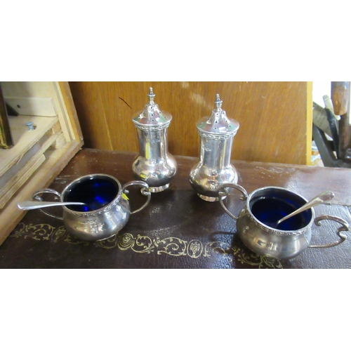 261 - A silver four piece cruet set