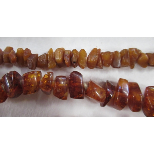 268 - Two amber coloured bead necklaces