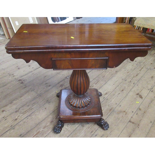 27 - A 19th century mahogany fold over games table