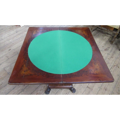 27 - A 19th century mahogany fold over games table