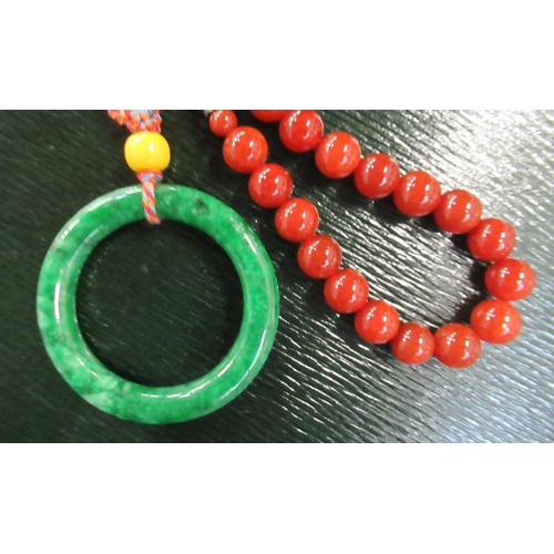 281 - A jade ring and beads