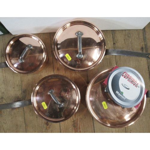 296 - A set of four graduated copper sauce pans, with lids