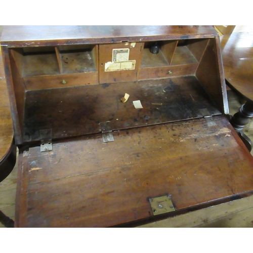 35 - An Antique oak bureau, width 33.5ins, together with an oak tripod table, diameter 29ins, height 30in... 