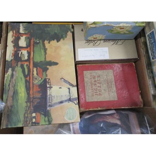 369 - Two boxes of assorted wooden jigsaws