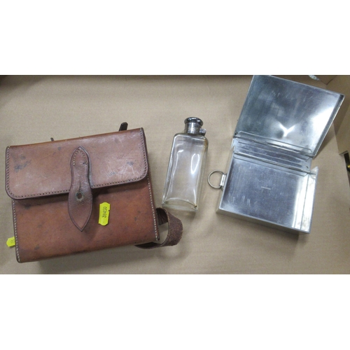 396 - A leather cased picnic set, with sandwich box and flask, together with a monocular binocular