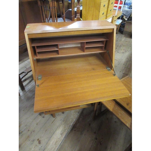 48 - A mid century bureau together with a nest of two tables