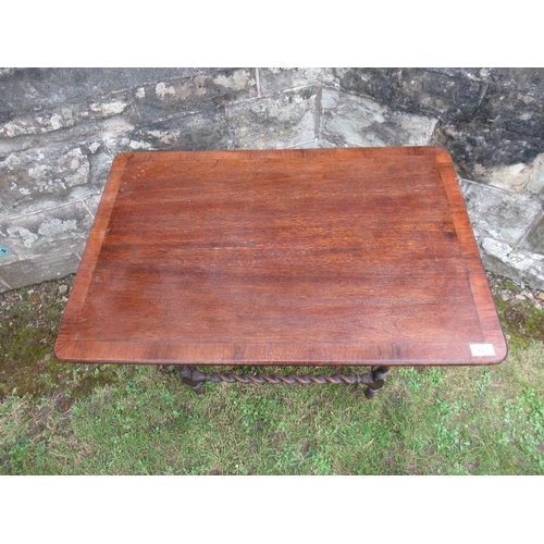 67 - A rectangular topped occasional table, with cross banded decoration  32ins x 21.5ins x 25ins