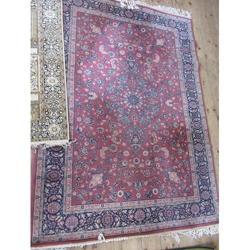 69B - A pink ground rug, 80ins x 55ins, together with two other rugs, 58ins x 36ins and 54ins x 27ins