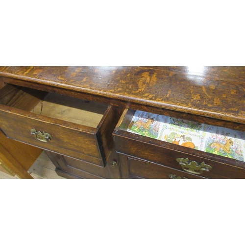 9 - An Antique oak dresser base, fitted with drawers and cupboards, width 64ins, depth 18ins, height 36.... 