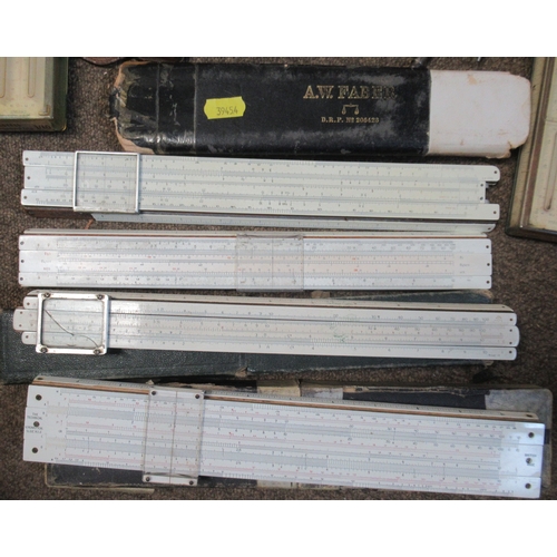 401 - A collection of slide rules and smoking related items