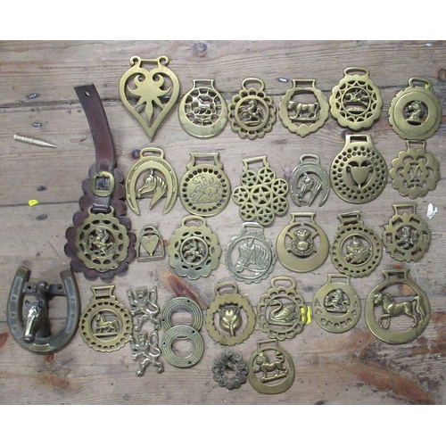 157 - A collection of horse brasses, together with horse bits