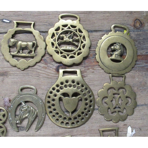 157 - A collection of horse brasses, together with horse bits