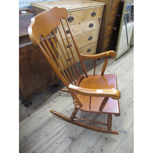 107 - A modern spindle back rocking  arm chair