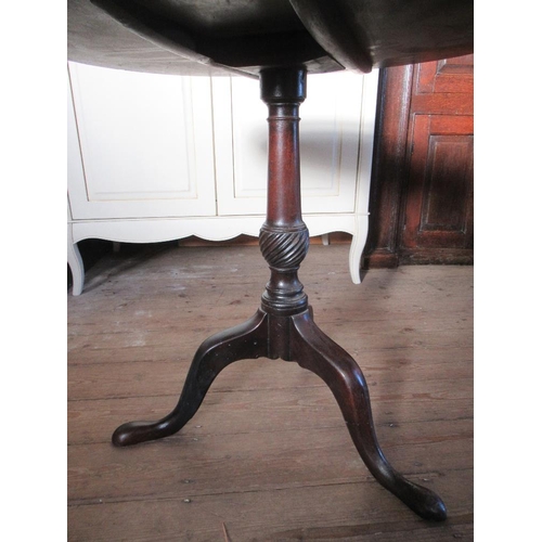 115 - A Georgian style circular occasional table raised on a tripod base with part wrythm  column width 30... 