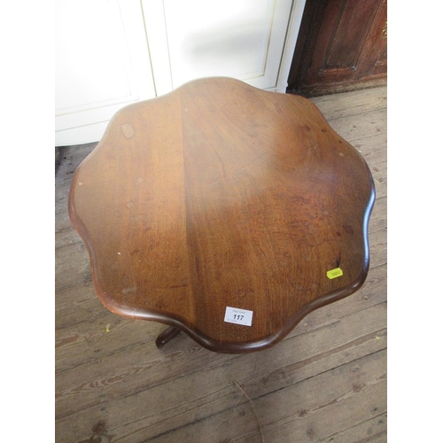 117 - A shaped occasional table raised on a tripod base max diameter 21ins, height 27.5ins