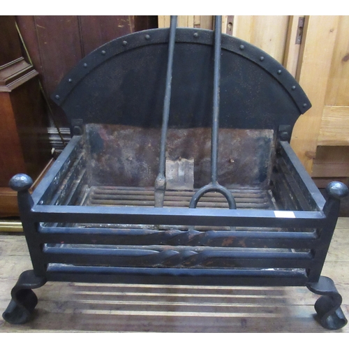 16 - An large wrought iron fire grate with irons, width 29ins, height 25ins