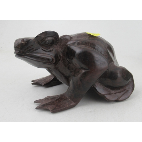 198 - An Indonesian carved model, of a bird, together with similar model of a frog in hardwood