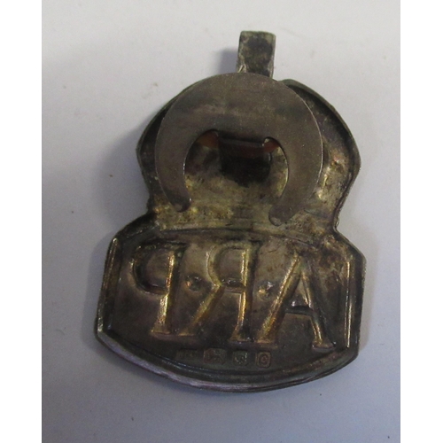 209 - ARP, two J Hudson & Co whistles, together with a badge