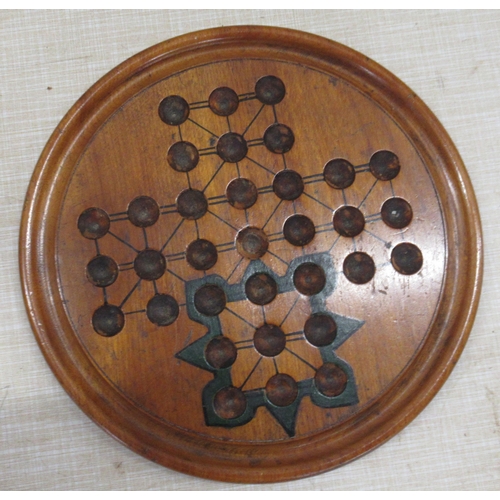 227 - A Victorian walnut double sided solitaire board, complete with marbles