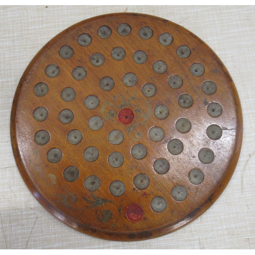 227 - A Victorian walnut double sided solitaire board, complete with marbles