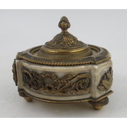 233 - A circular French ormalu and marble inkstand, with a decorated frieze of foliage and swags, raise do... 